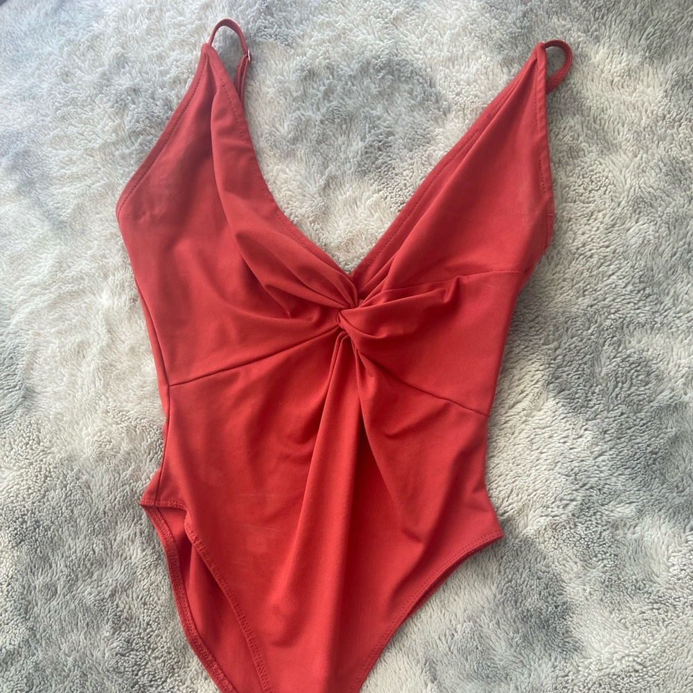 Burnt orange bodysuit tie in front